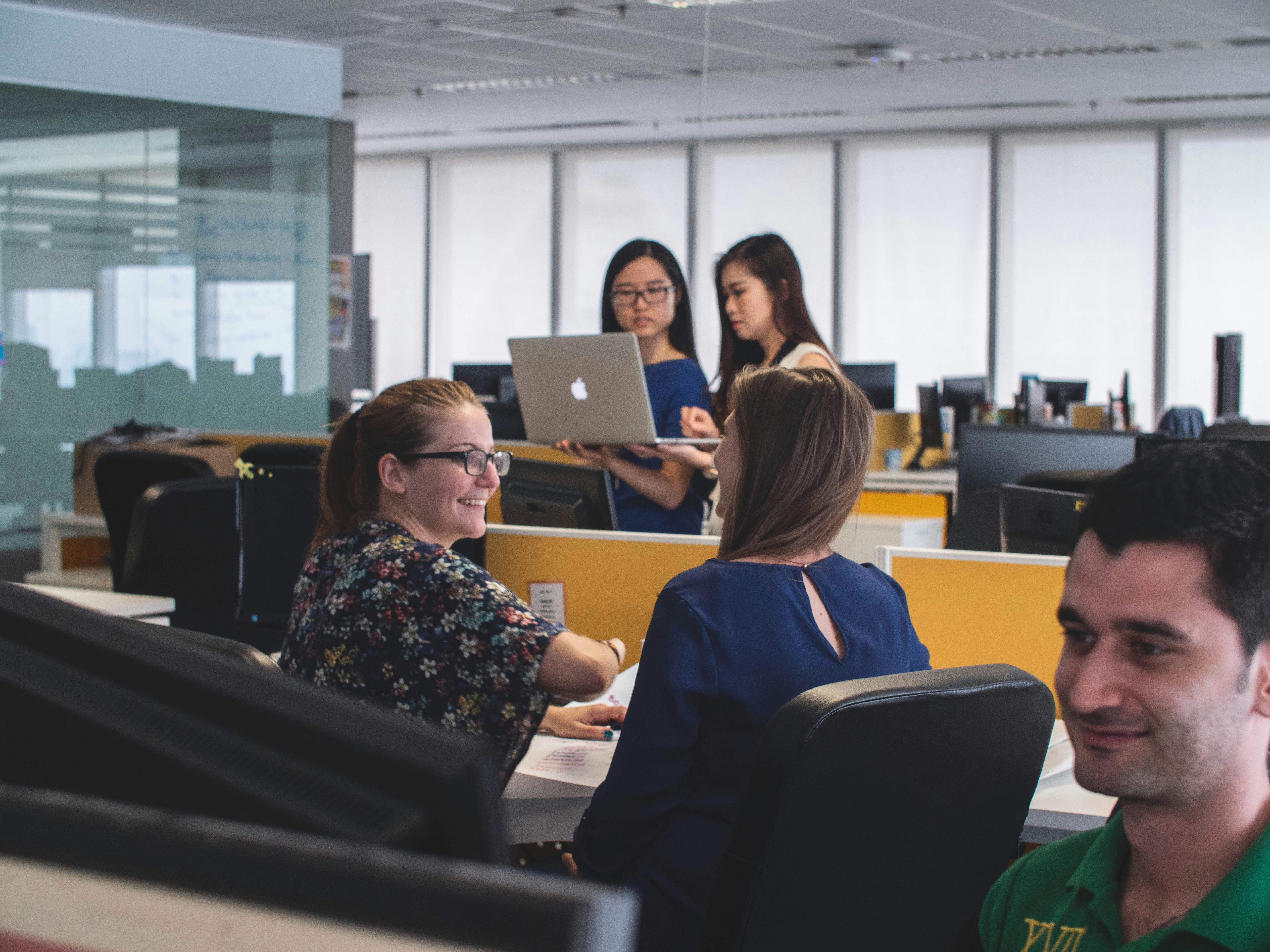 An image showing young office workers in a dynamic office