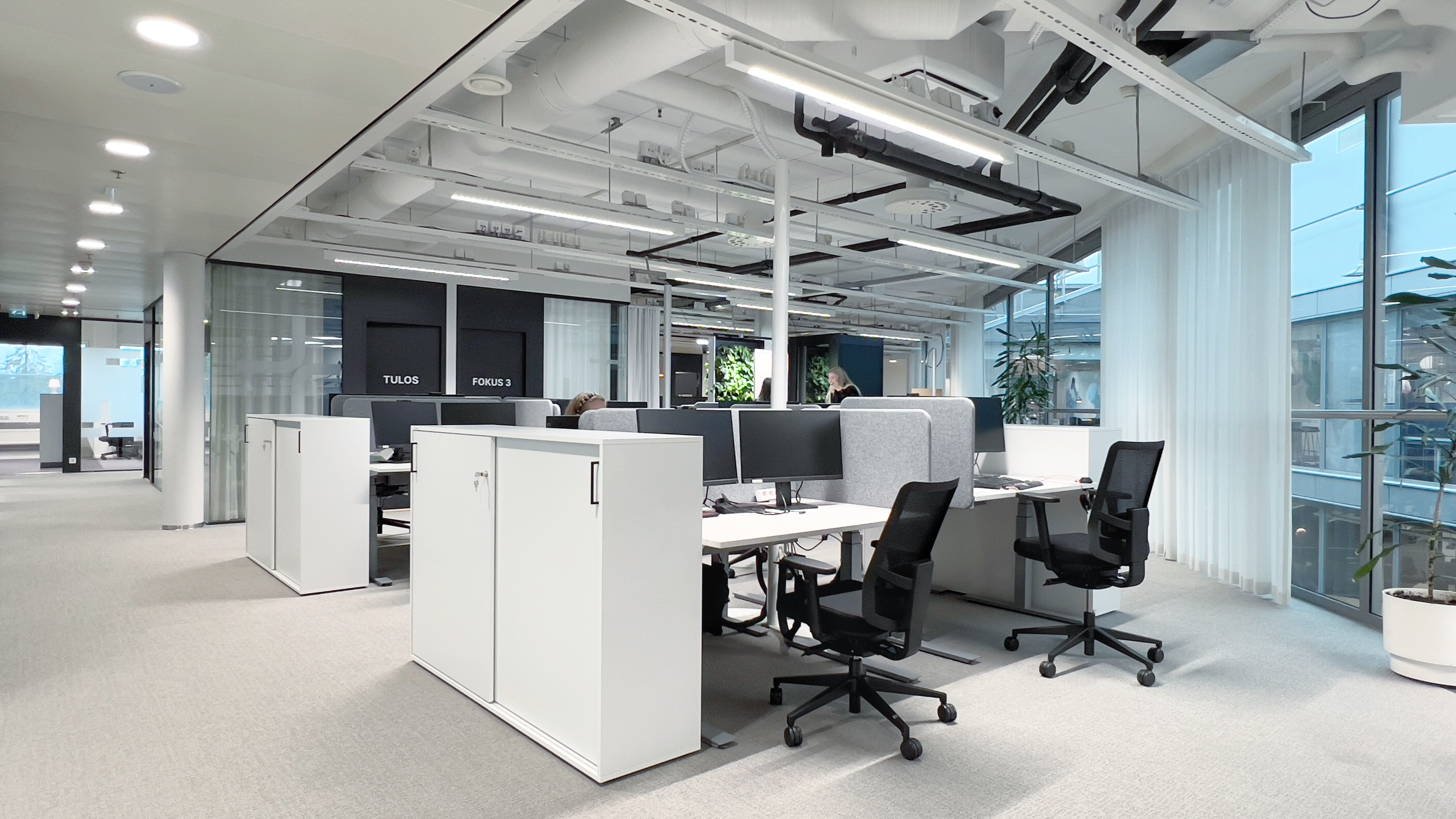 A photograph of an open-plan work space, designed for Figure by Itu Design